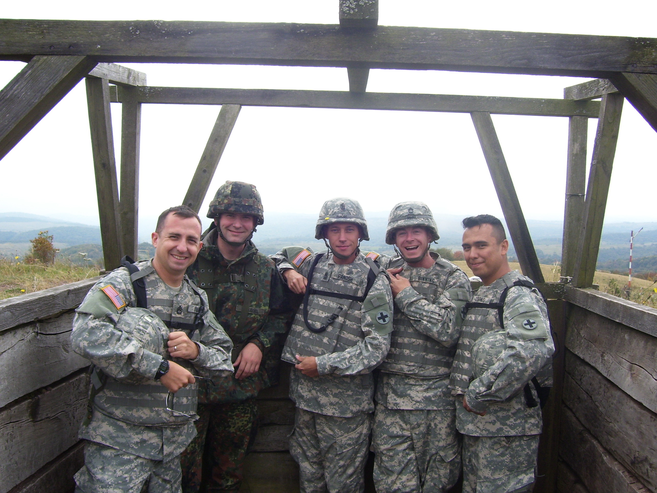 John and soldiers on hilltop overlook in Germany